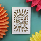 A cream and gold paper cut card for Father's Day, featuring a rosette with the words "No. 1 Dad"