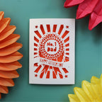 A cut out  Father's Day card featuring a rosette that says "No. 1 Dad" and "Happy Father's Day