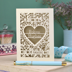 Laser cut "on your naming day" card personalised with the date and the name of the recipient, with a floral heart border