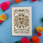 Personalised wife anniversary card with decorative heart design on a blue background with colourful pom-poms.