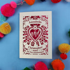 Keepsake Personalised anniversary card with decorative heart design on a blue background with colourful pom-poms.