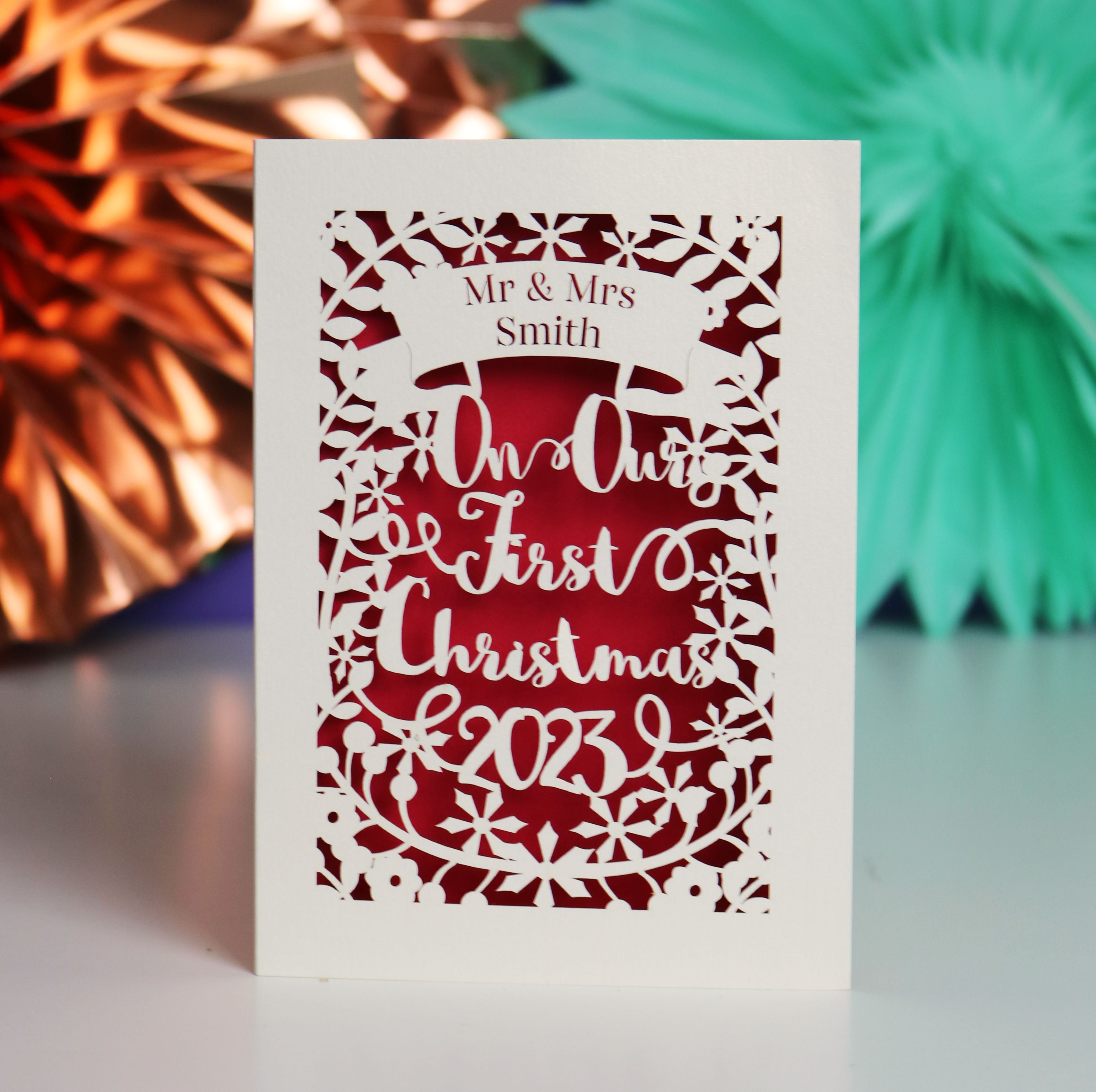Personalized Our First Christmas card with decorative elements 