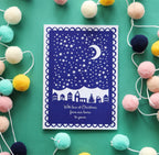 Navy blue and white Christmas card with the words "With love at Christmas from our home to yours"