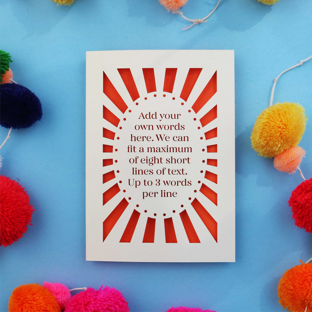 A personalised laser cut card with your own text surrounded by a laser cut border,with an orange paper backing.