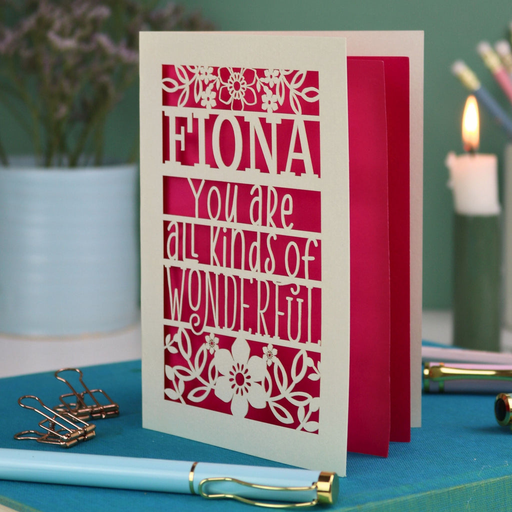 A laser cut greetings card personalised with the name Fiona, and with the text "You are all kinds of wonderful"