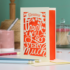 A cream laser cut thank you card with personalised name at the top in a banner, over text 'thank you so very much'
