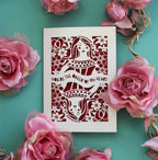 A laser cut Valentine's card inspired by the Queen of hearts.