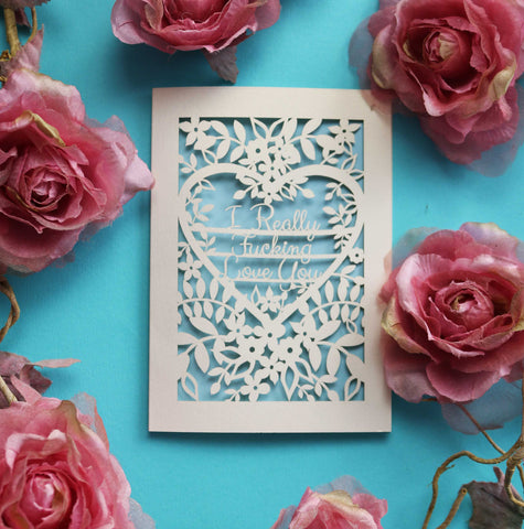 A unique laser cut Valentines card that says "I really fucking love you" surrounded by flowers and leaves - A5 (large) / Light Blue