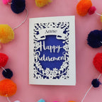 A laser cut card for a parent's retirement. Card is personalised with a name and says "Happy Birthday"