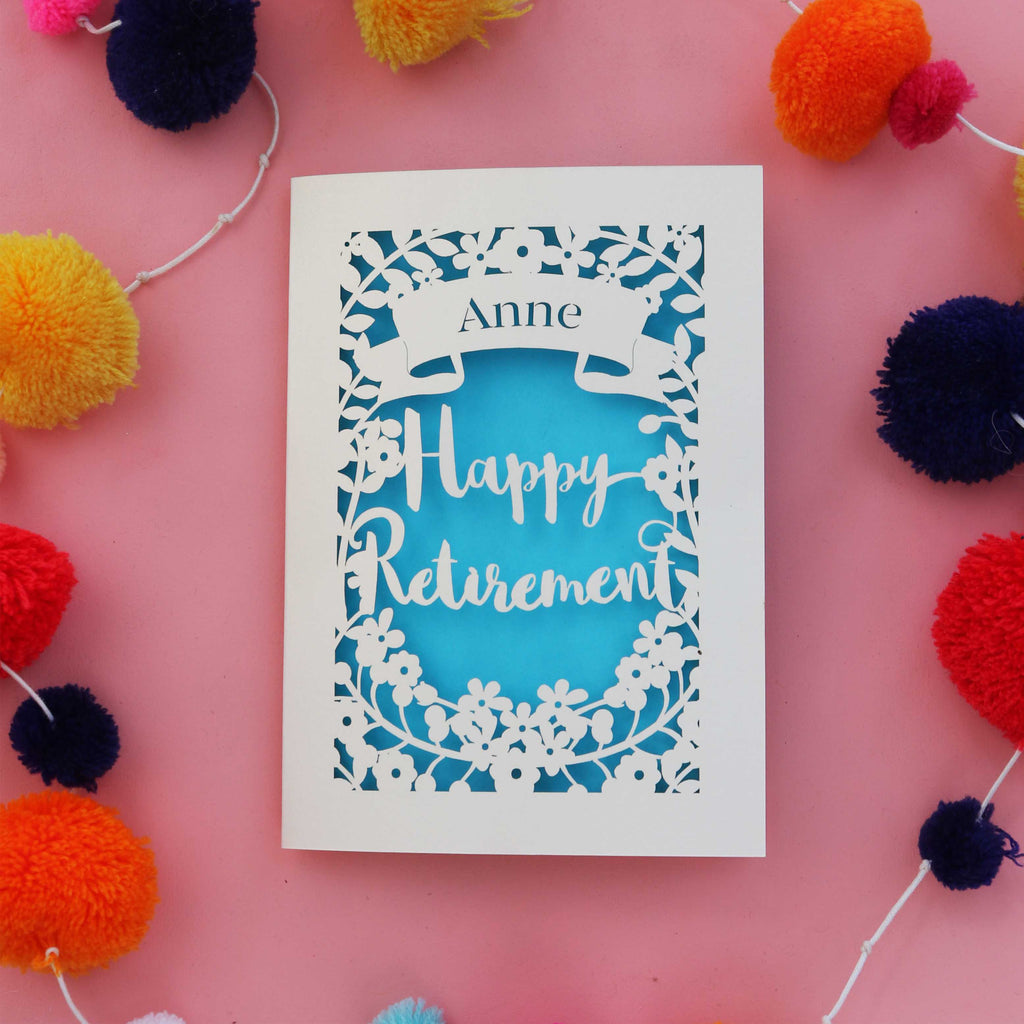 A cream and blue happy retirement card, laser cut and personalised with a first name. Perfect for mum's retirement