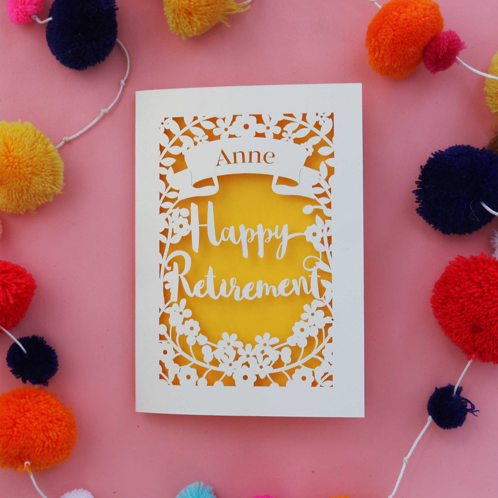 A cream and yellow personalised retirement card with flowers and leaves