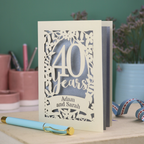 Personalised cut out ruby anniversary card with floral design and '40 years, Adam and Sarah'