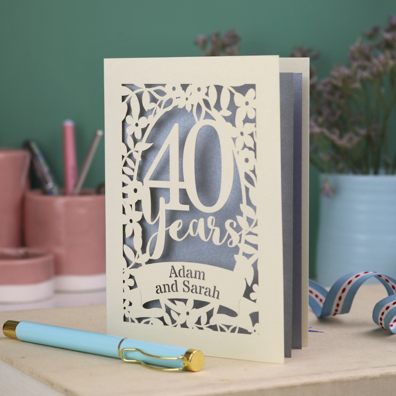 Personalised cut out ruby anniversary card with floral design and '40 years, Adam and Sarah'