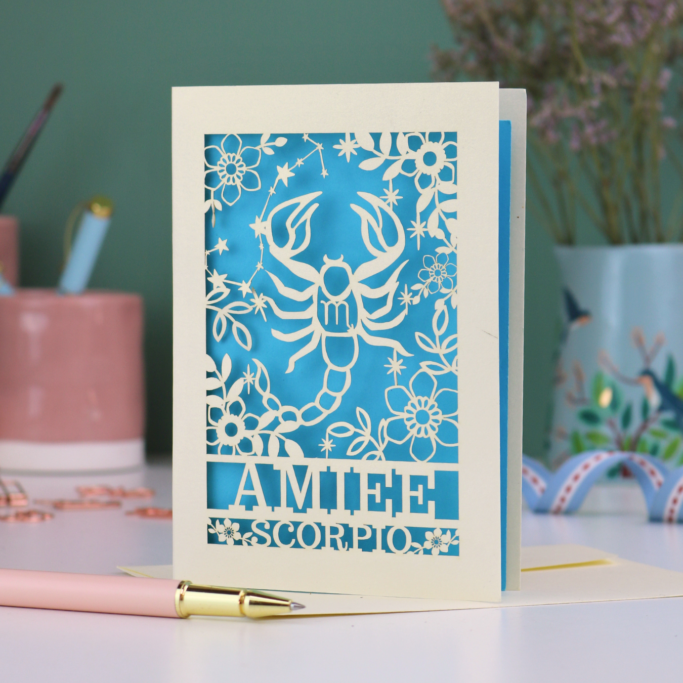 Scorpio birthday card with laser cut scorpion and constellation design, personalised with the name "Amiee" and text 'Scorpio' underneath