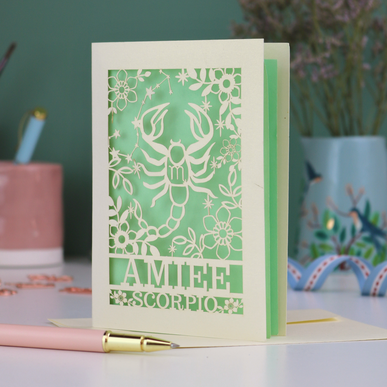Scorpio birthday card with laser cut scorpion and constellation design, personalised with the name "Amiee" and text 'Scorpio' underneath