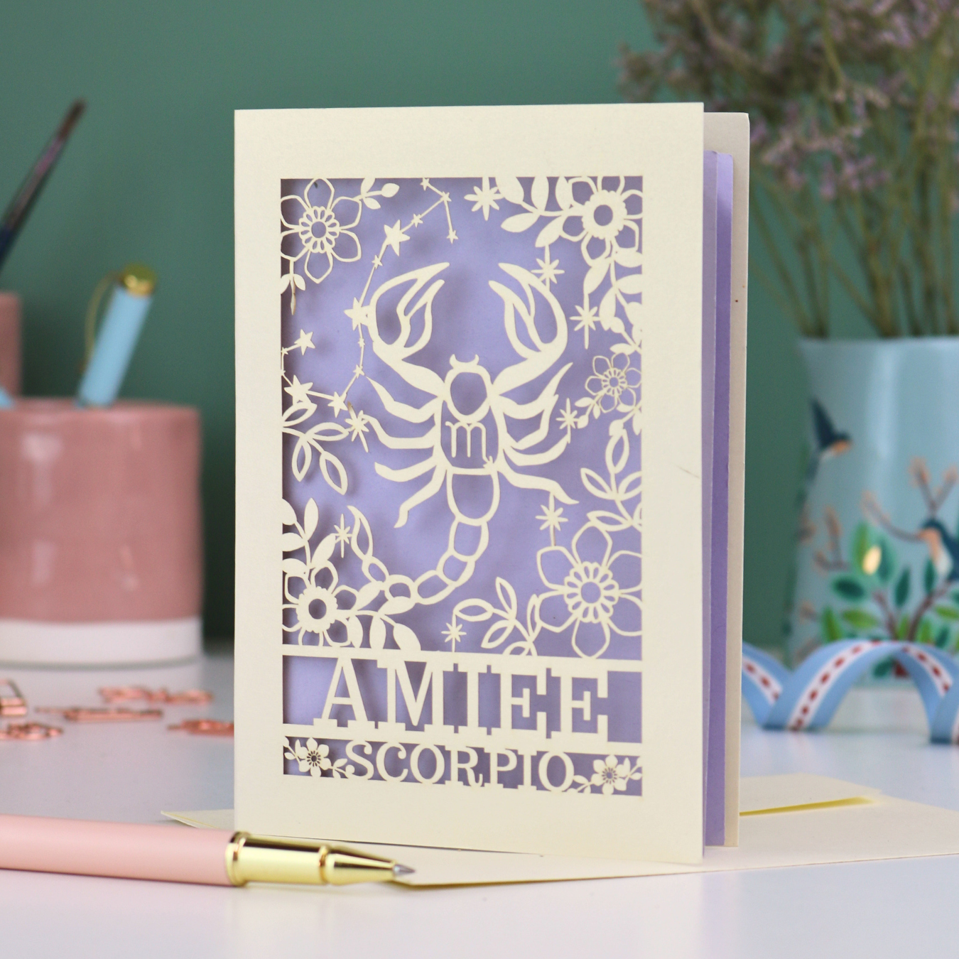Scorpio birthday card with laser cut scorpion and constellation design, personalised with the name "Amiee" and text 'Scorpio' underneath
