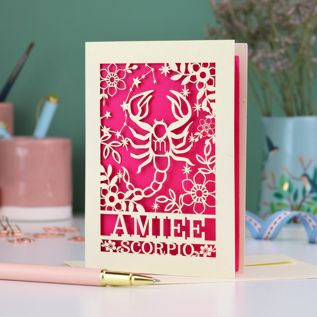 Scorpio birthday card with laser cut scorpion and constellation design, personalised with the name "Amiee" and text 'Scorpio' underneath