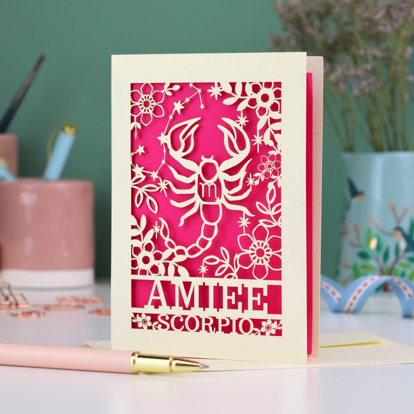 Scorpio birthday card with laser cut scorpion and constellation design, personalised with the name "Amiee" and text 'Scorpio' underneath