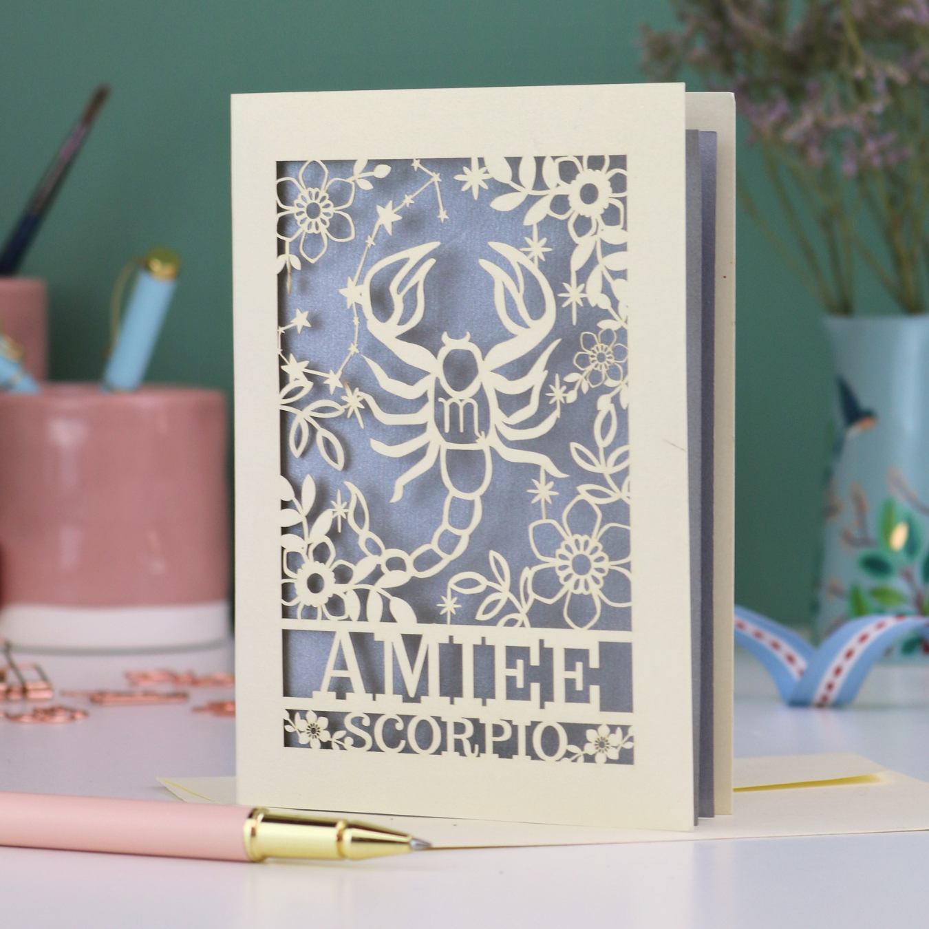 Scorpio birthday card with laser cut scorpion and constellation design, personalised with the name "Amiee" and text 'Scorpio' underneath