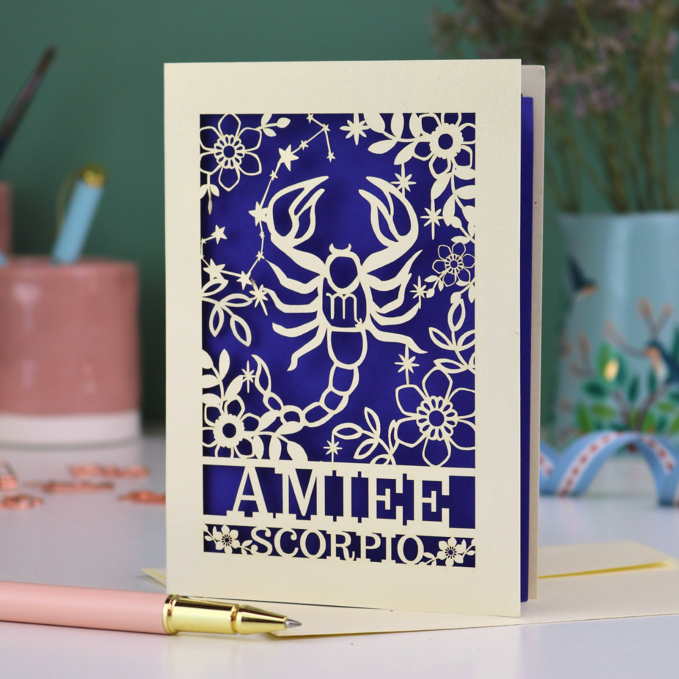 Scorpio birthday card with laser cut scorpion and constellation design, personalised with the name "Amiee" and text 'Scorpio' underneath
