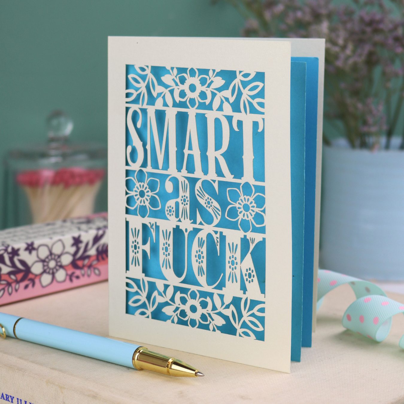 Funny graduation card with rude laser cut text, "Smart as F*ck" and a floral design