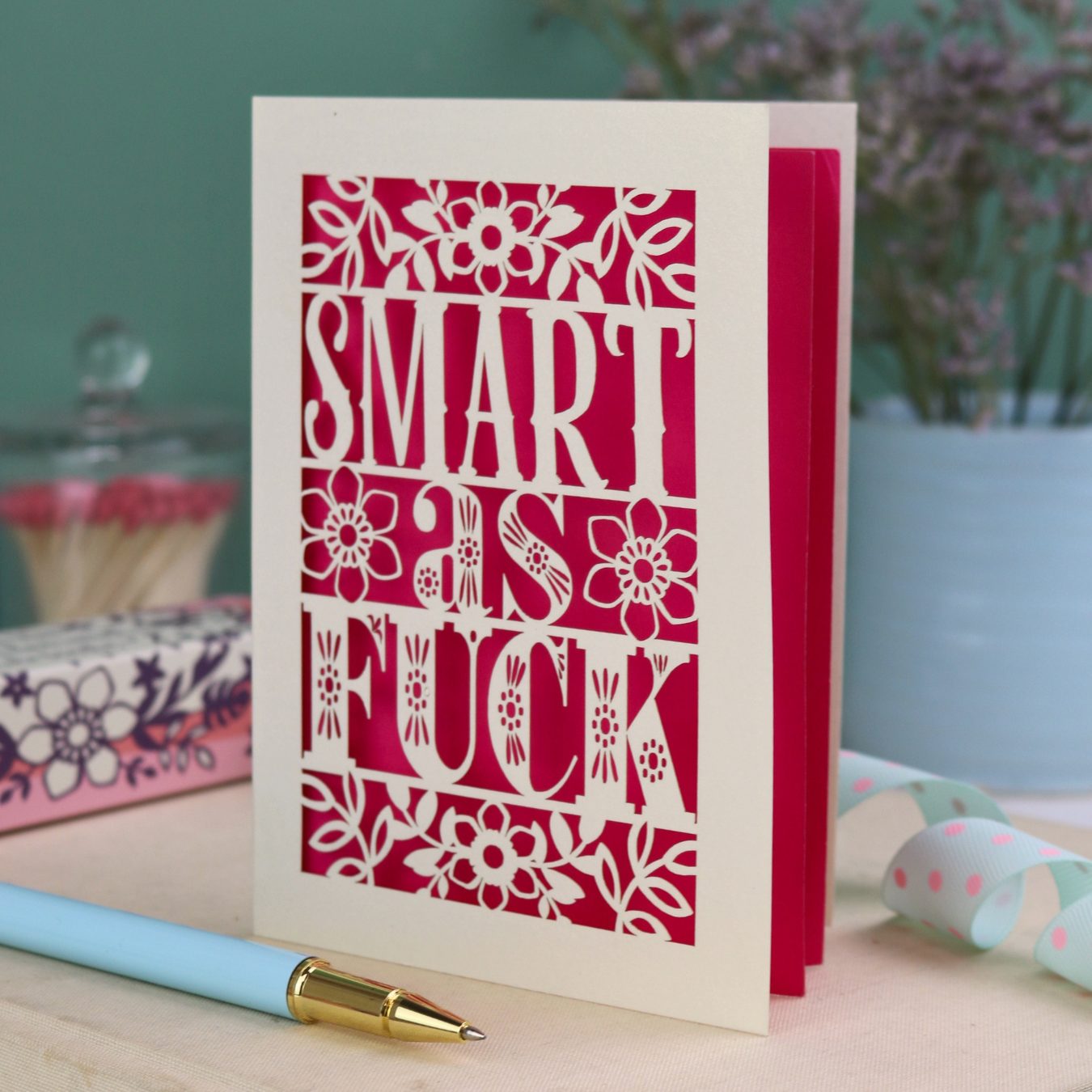 Funny graduation card with rude laser cut text, "Smart as F*ck" and a floral design
