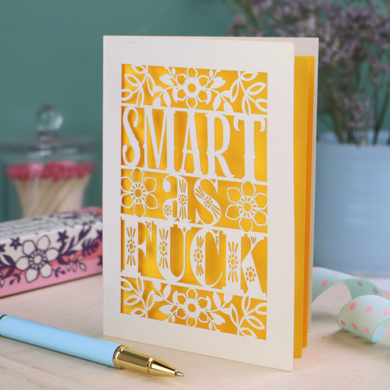 Funny graduation card with rude cut out text, "Smart as F*ck"