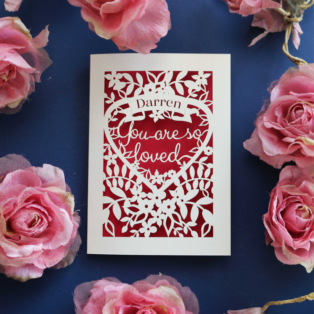 Paper cut Valentines cards that say "Name, you are so loved"