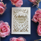 A cut out Valentines card that says "Name, you are so loved"