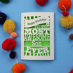 Birthday Cards for son with 'Happy Birthday to the most awesome son ever' text on a blue background with colourful pom-poms.