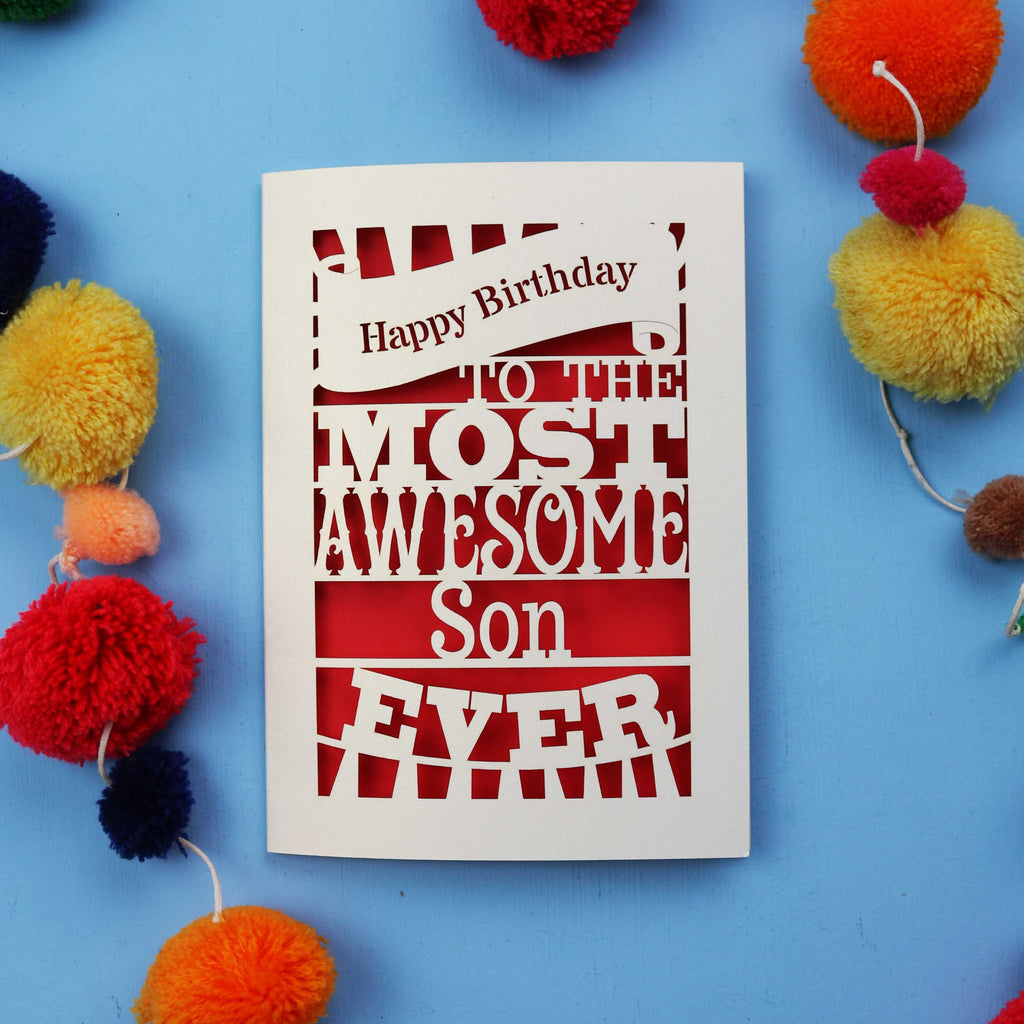 Paper cut Son Birthday Card with 'Happy Birthday to the most awesome son ever' text on a blue background with colourful pom-poms.