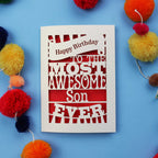Paper cut Son Birthday Card with 'Happy Birthday to the most awesome son ever' text on a blue background with colourful pom-poms.