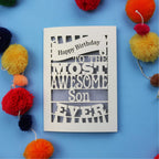 Son Birthday Card with 'Happy Birthday to the most awesome son ever' text on a blue background with colourful pom-poms.