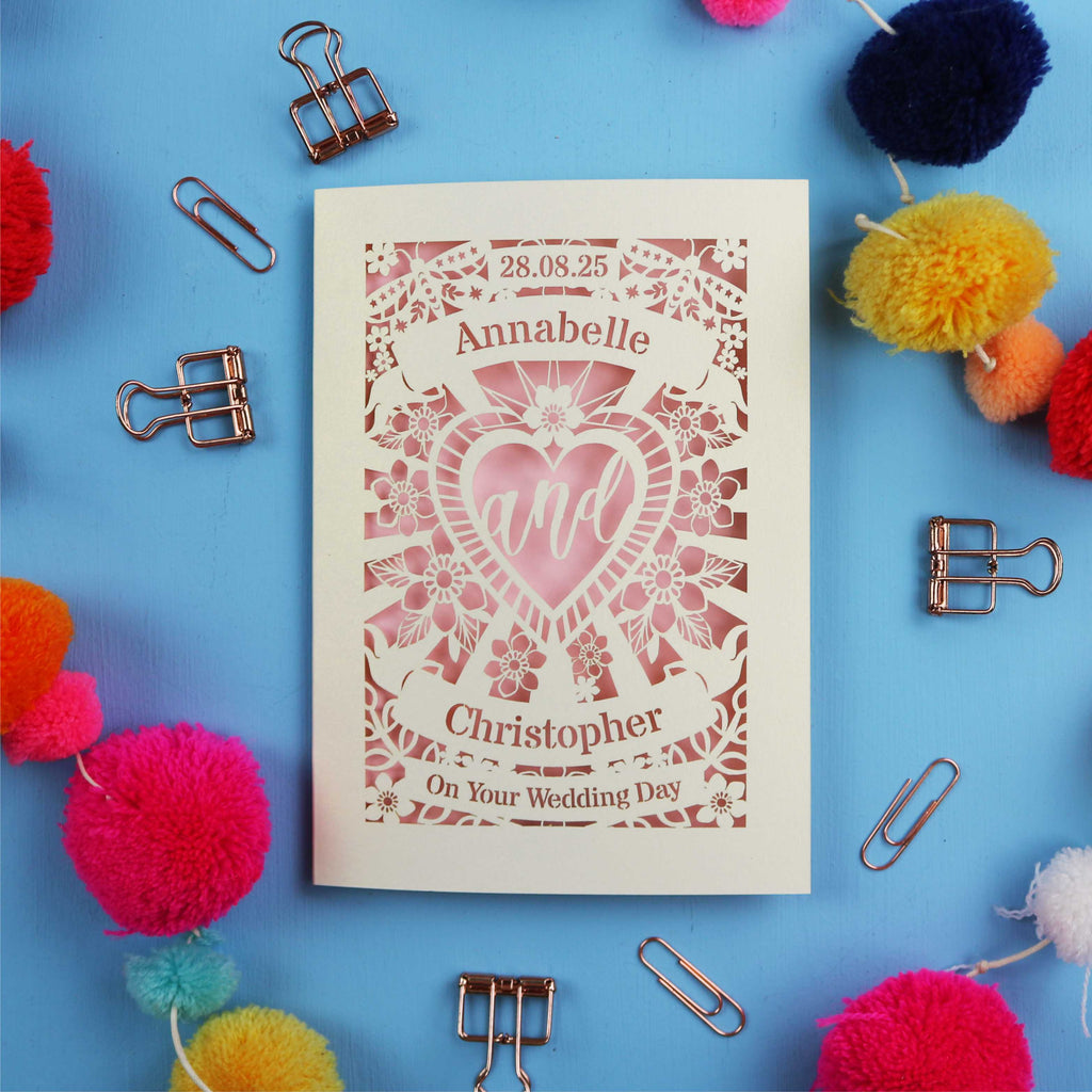 Personalized wedding card with decorative elements on a blue background