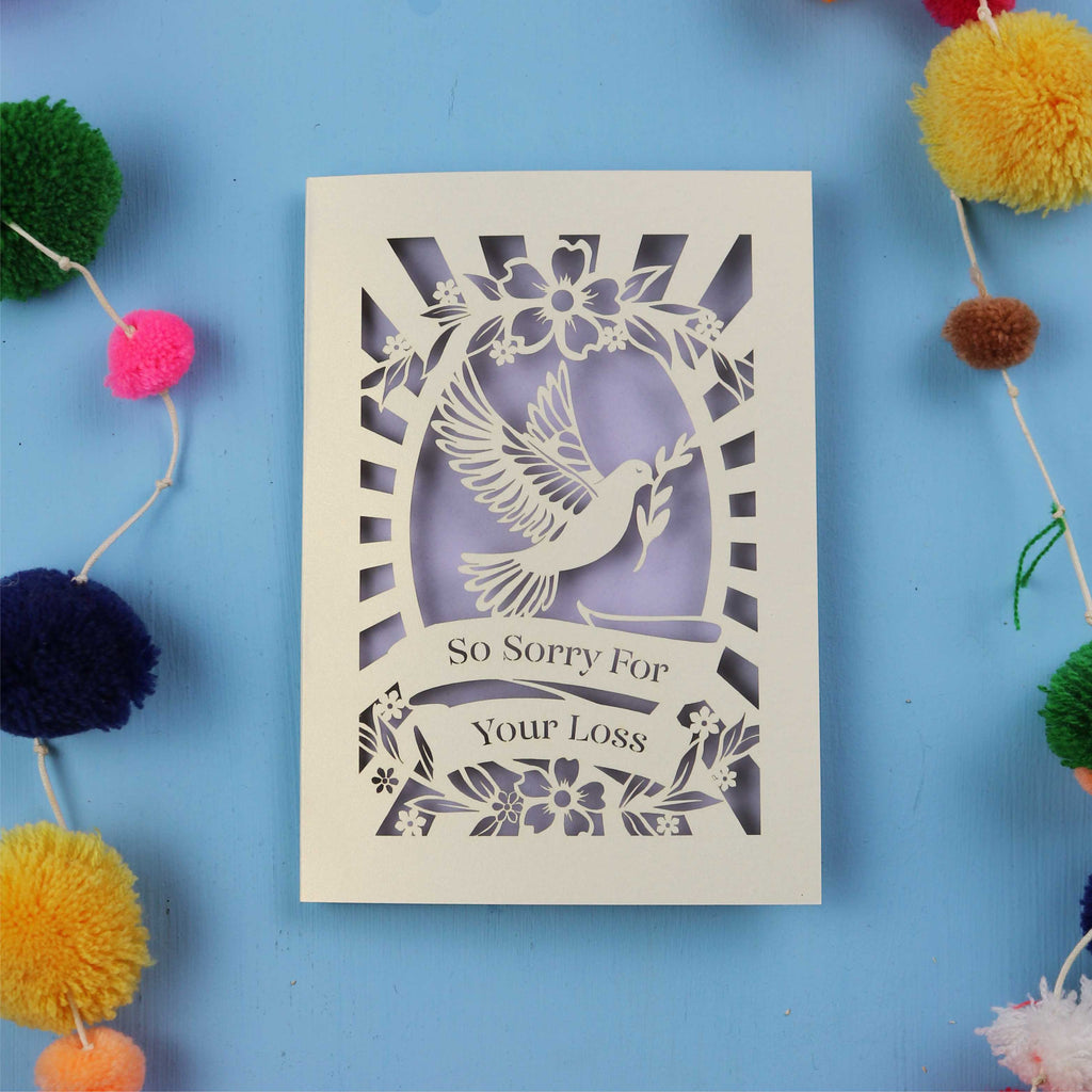 Papercut Sympathy Card with 'So Sorry For Your Loss' text and dove design on a blue background.