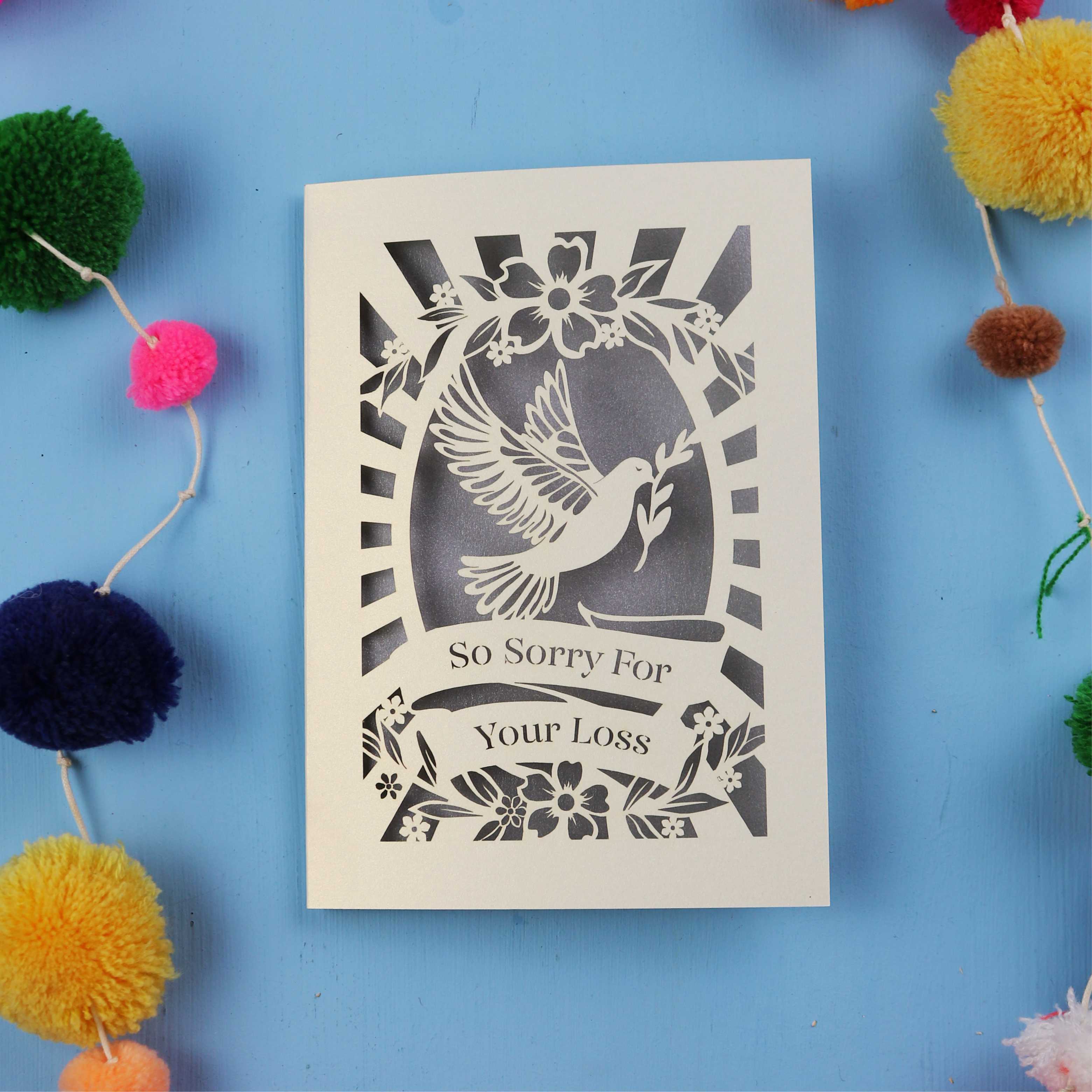 Beautiful Sympathy Card with 'So Sorry For Your Loss' text and dove design on a blue background.