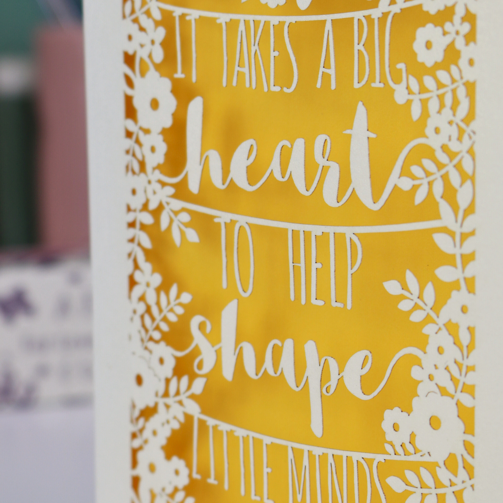 A Laser cut thank you teacher card with decorative text, 'It takes a big heart to help shape little minds' and floral patterns