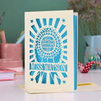 A special thank you teaching assistant card with cut out rosette design and text "Best Teaching Assistant Ever" and personalised with the name "Miss Watson"
