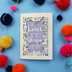 Thank you teacher card with motivational quote surrounded by colourful pom-poms on a blue background