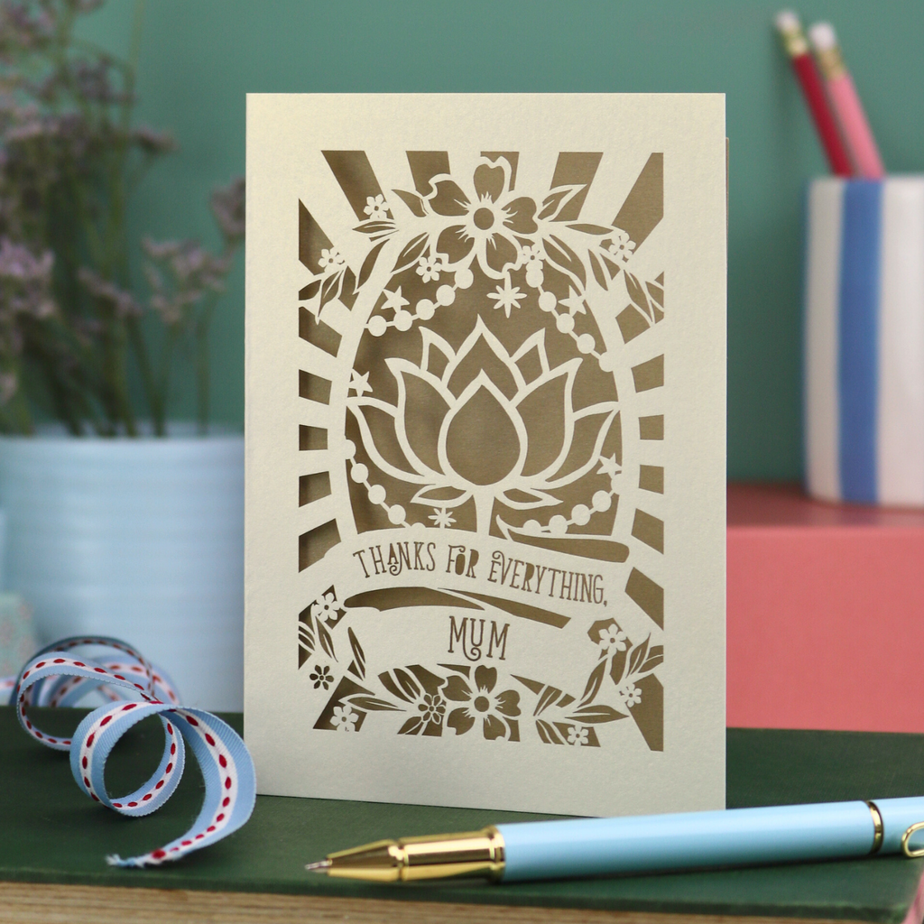 Thank you Mum Card with floral design and text on a desk with stationery items