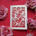 A paper cut greetings card featuring an illustration inspired by the lovers tarot card