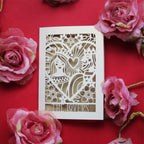 A laser cut  Valentine's card featuring an illustration inspired by the lovers tarot card