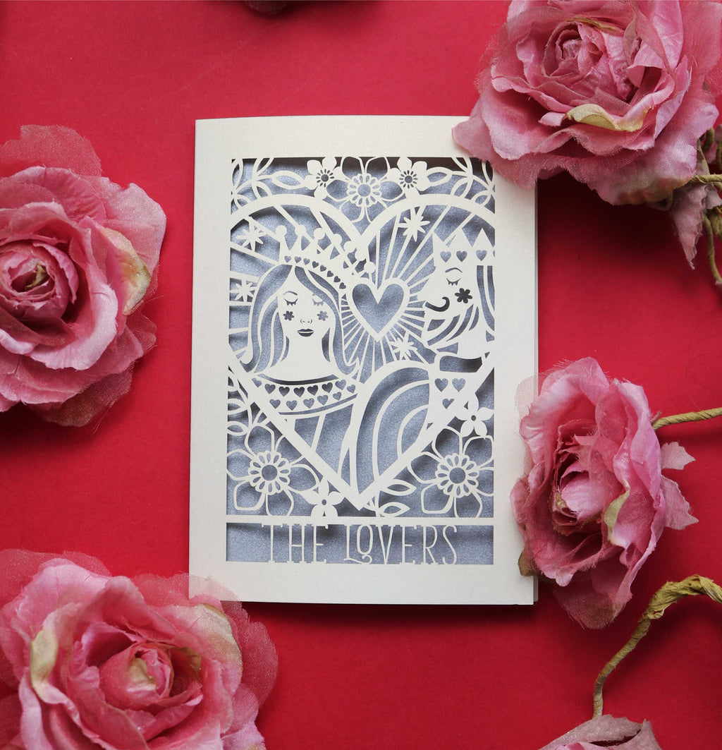 A cut out love card for a couple,  featuring an illustration inspired by the lovers tarot card