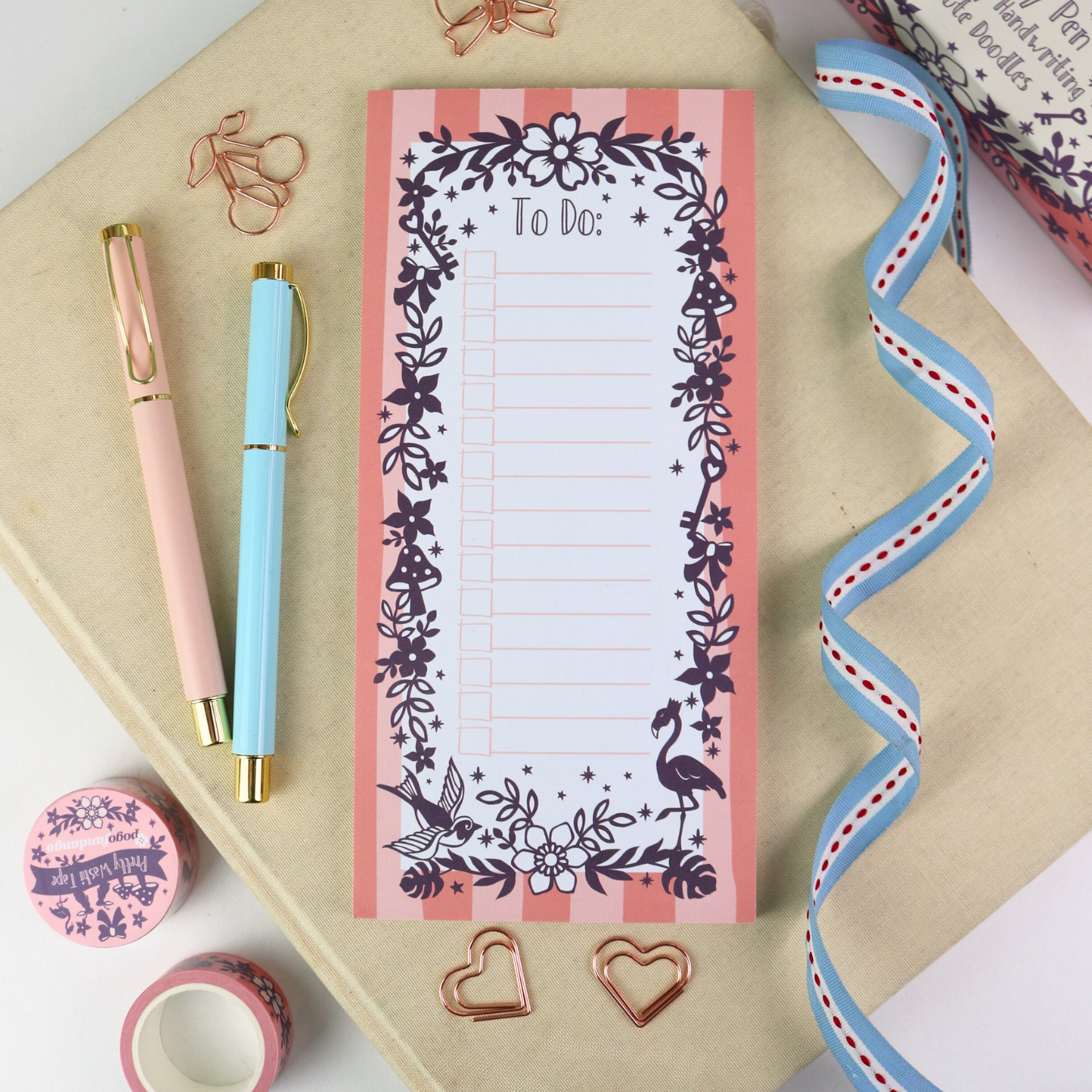 A pink and white slim notepad for "To Do" lists