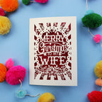 Wife Christmas card with 'Merry Christmas to my Wife' text on a blue background with colourful pom-poms.
