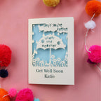 A paper cut out get well soon card made in the UK