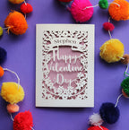 A cut out card for Valentine's day, personalised with a name, with the words "Happy Valentine's Day" in a script font