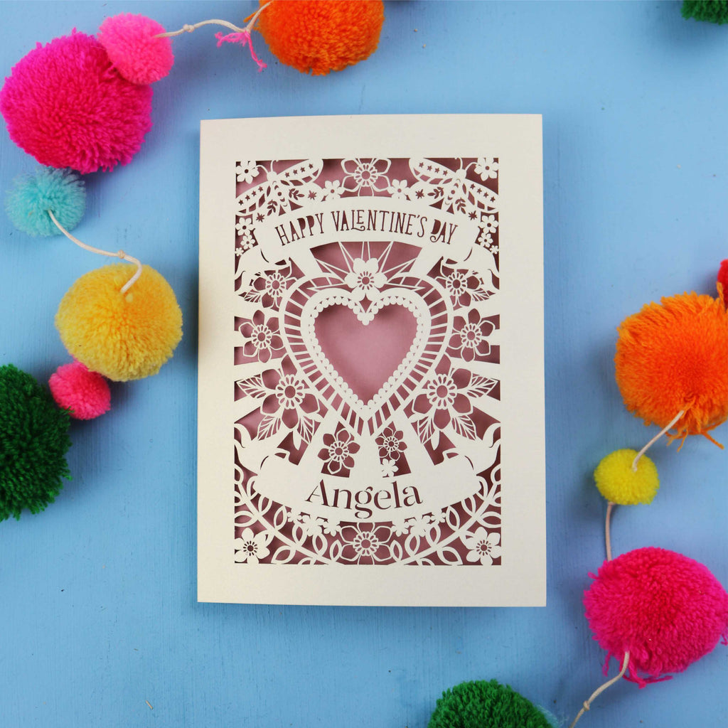 Luxury Valentine's cards with decorative heart design on a blue background with colourful pom-poms.