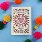 Luxury Valentine's cards with decorative heart design on a blue background with colourful pom-poms.