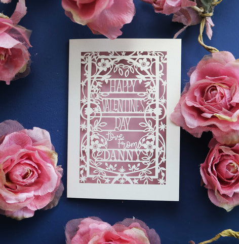 A personalised Valentine's card, laser cut with a floral and star border and the words "Happy Valentine's Day, Love from NAME" - A6 (small) / Dusky Pink